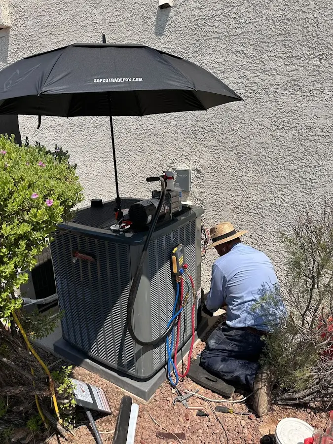 HVAC technician performing outdoor AC maintenance in Colleyville