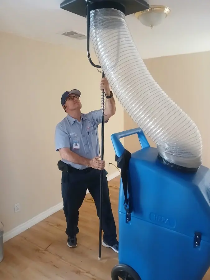 Furnace Tune-Up technician using HEPA equipment in Colleyville